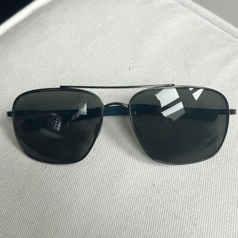 Costa “Canaveral” titanium metal framed with polarized grey glass lens.
